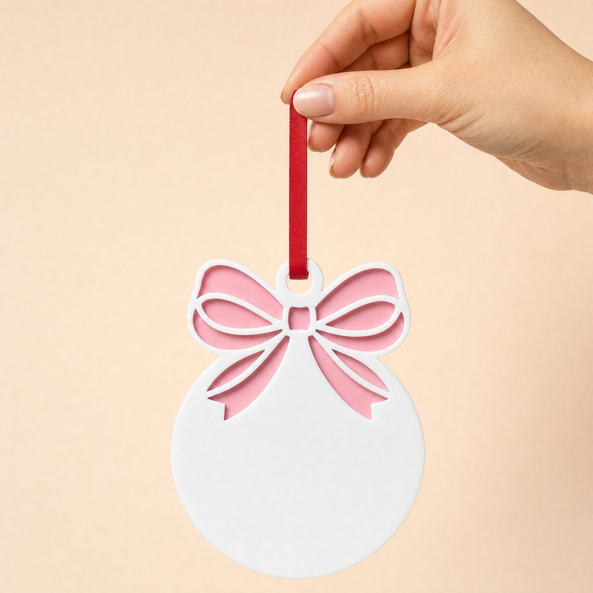 Bow bauble acrylic Christmas decoration, white bauble with pastel pink acrylic bow backing and red ribbon, KWC6342PP