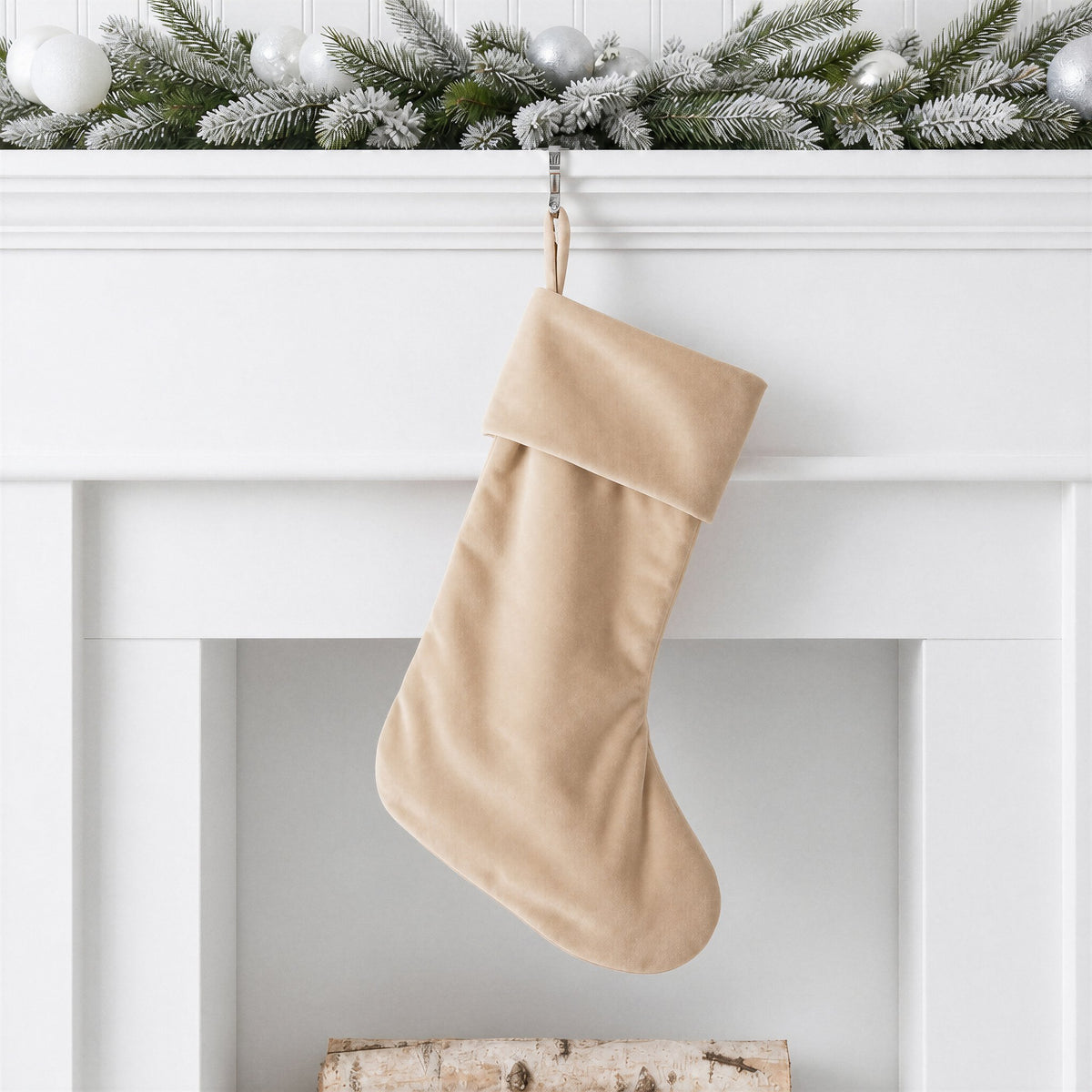 Neutral beige plain velvet Christmas stocking with self fabric hanging loop on a white mantelpiece with frosted garland - wholesale blank for sublimation, embroidery, HTV and DTF, KWC8854N
