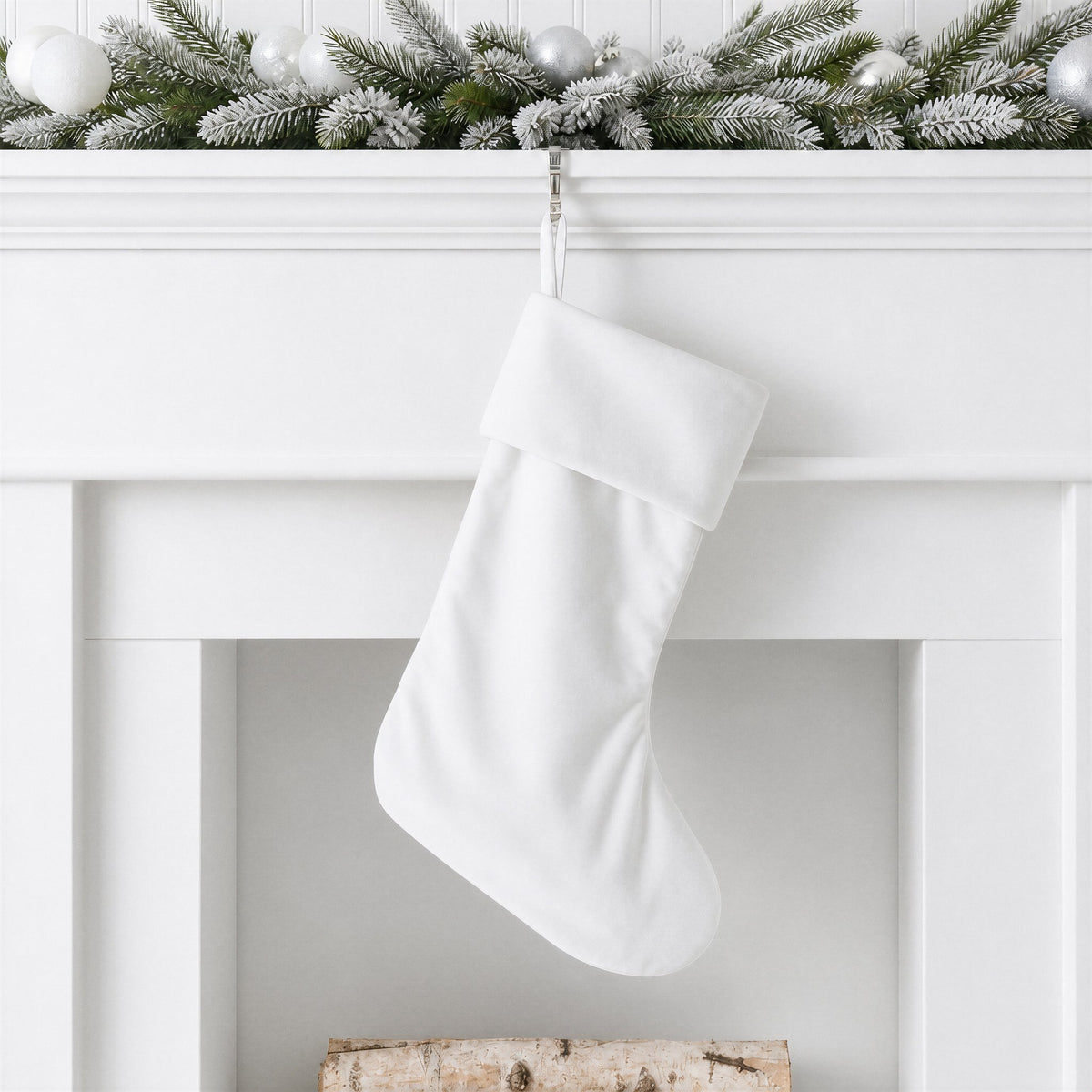 White plain velvet Christmas stocking with self fabric hanging loop on a white mantelpiece with frosted garland - wholesale blank for sublimation, embroidery, HTV and DTF, KWC8854W