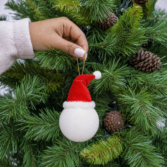 White plush Santa bauble decoration with red Santa hat and gold hanging string being hung on a Christmas tree - wholesale blank for personalisation, KWC6510