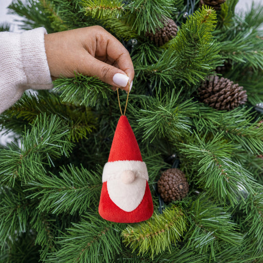 Red plush Santa gonk gnome Christmas decoration with white beard and gold hanging string being hung on a Christmas tree - wholesale blank for personalisation, KWC3635