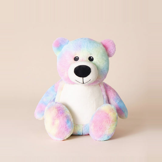 Tummi Bears Dizzy the Tie Dye Bear rainbow plush soft toy, front view on a studio background - wholesale blank for personalisation, KWC2989